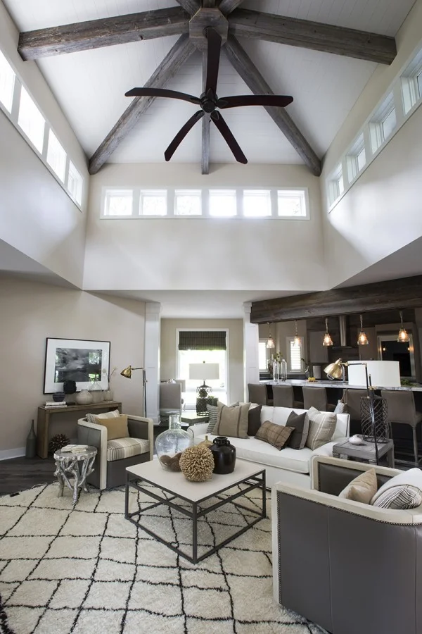 living room with vaulted ceiling, wood beams    