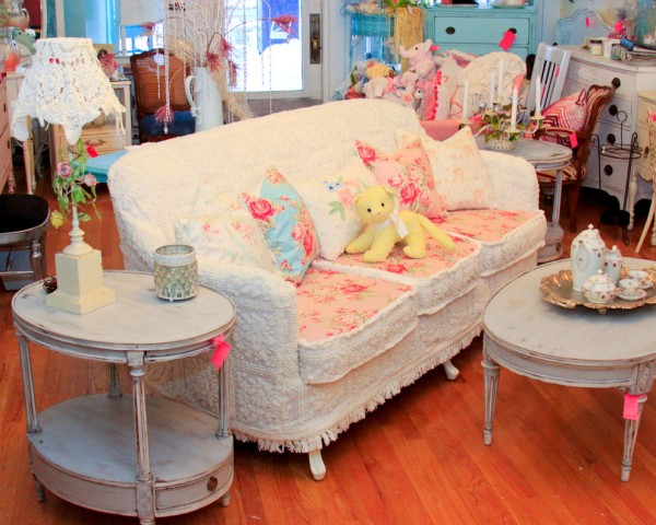 shabby chic sofa slipcovered with vintage chenille bedspreads and roses fabrics