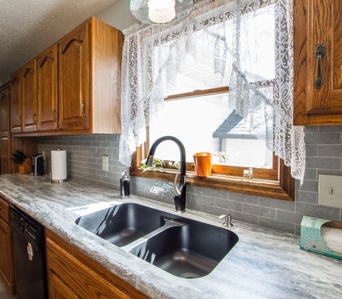 granite countertops with natural wood cabinets