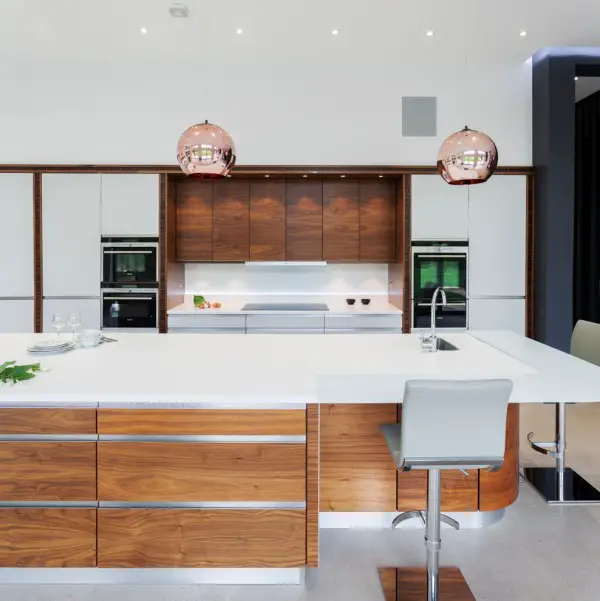 Stylish copper kitchen featuring accent lighting