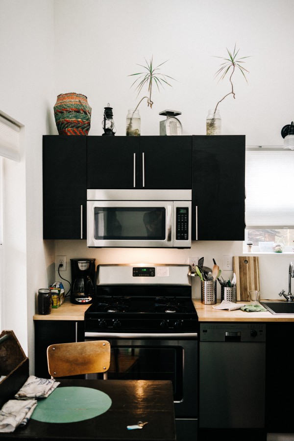 Wooden Countertops and Black Cupboards