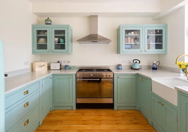 Turquoise shaker cabinets in a farmhouse kitchen 