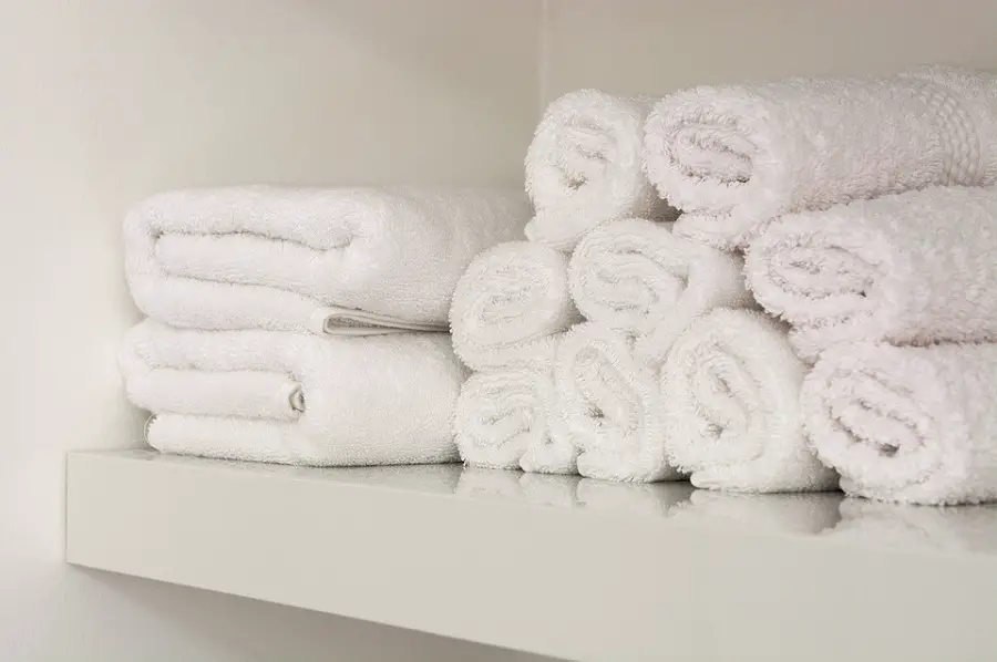 bathroom towels on shelves