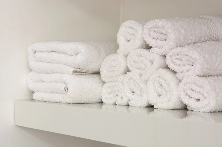 bathroom towels on shelves