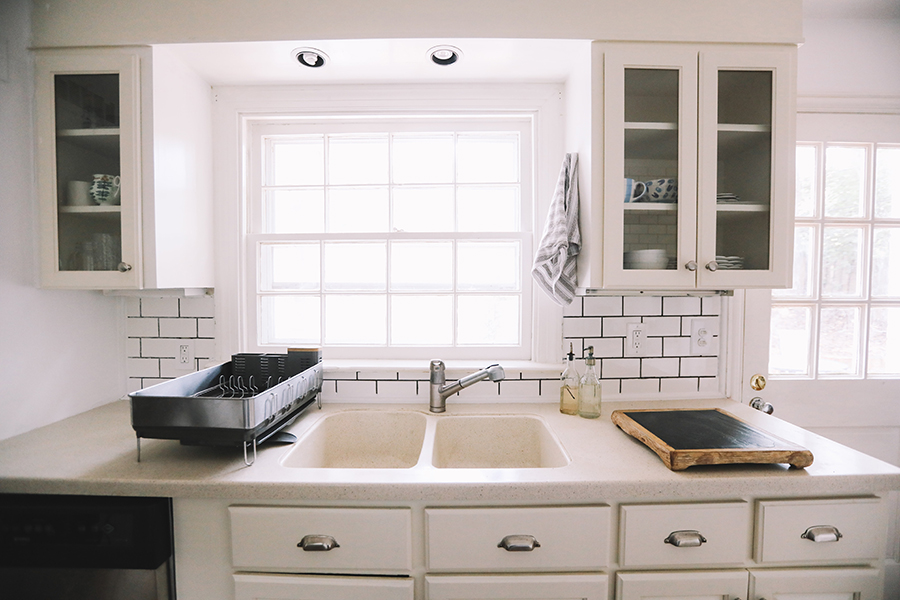 cleaning a poured one piece kitchen sink and countertop