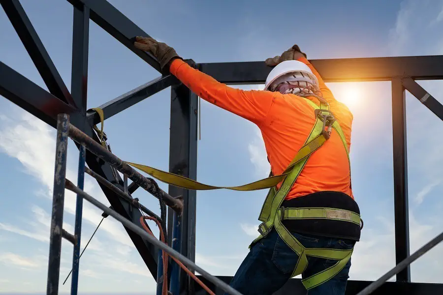 construction worker wears fall protection