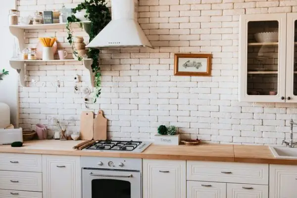 Painting Existing Brick White kitchen with brick backsplash