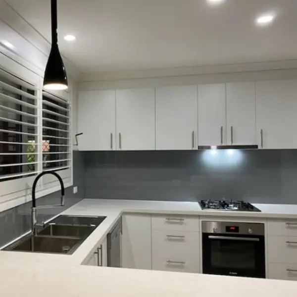 Moda Glass Works kitchen with glass backsplash
