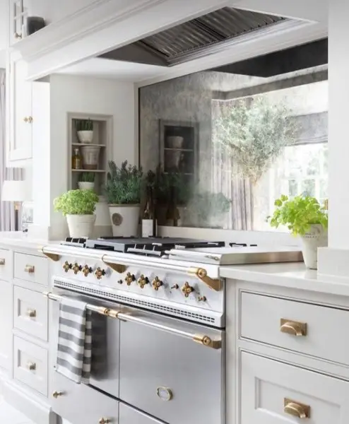 Michelle | One Coast Design kitchen with mirror backsplash