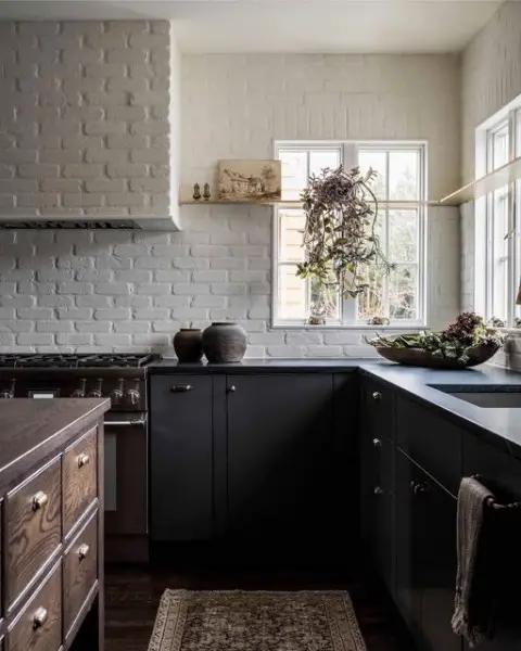 White Brick and Modern Black Cabinets black kitchen cabinets