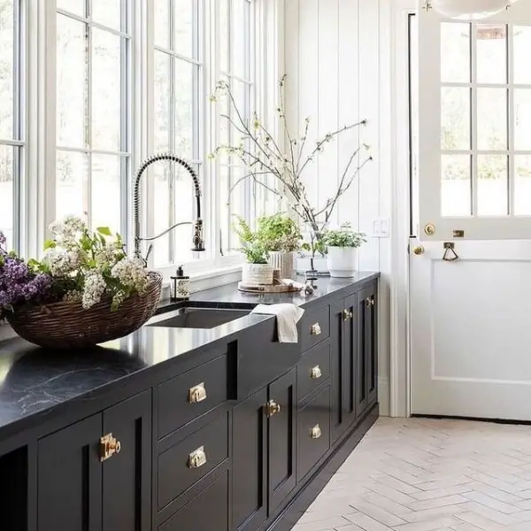 Dark Cabinetry with Fresh Greenery black kitchen cabinets