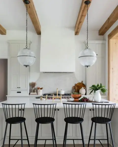 Love this kitchen, so much character and charm. kitchen with island and dining table