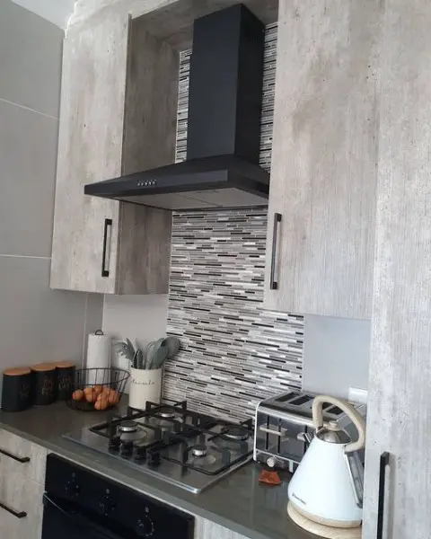 Maphuti Coetzee's Kitchen Transformation kitchen with mosaic tiles