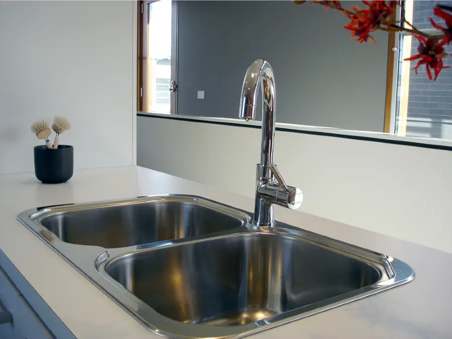 steel bar sink with gooseneck faucet