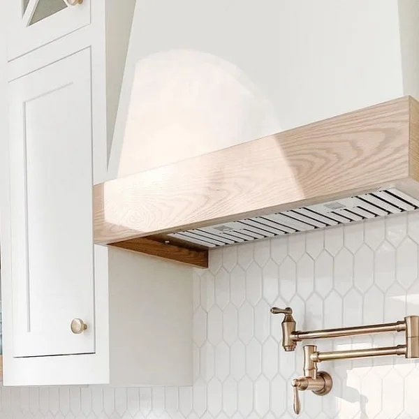 Sleek And Timeless Kitchen Range Hood In A White Farmhouse-inspired Space kitchen range hood
