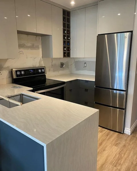 Sleek And Contemporary U-Shape Condo Kitchen With Cambria Delgatie Quartz Countertops And Wine Storage u-shape kitchen