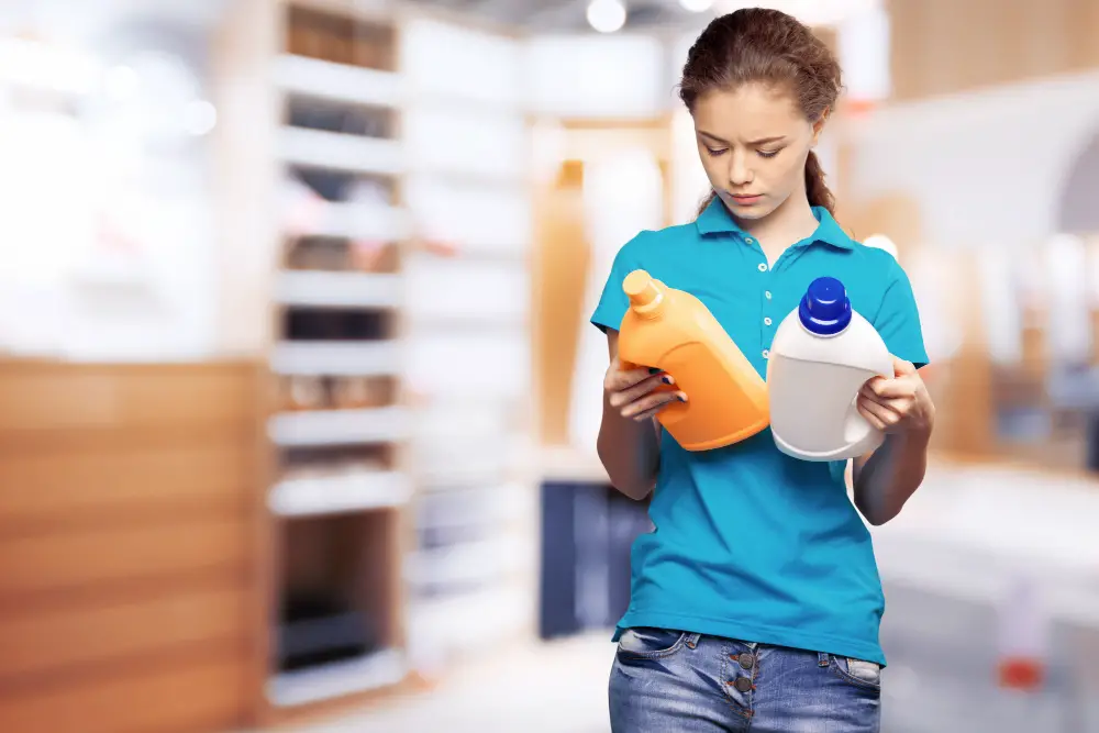 girl reading label on cleaning product