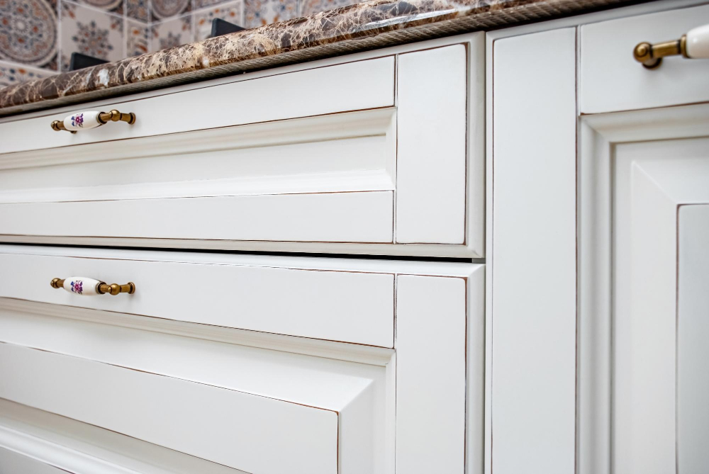 Brass hardware on white cabinets