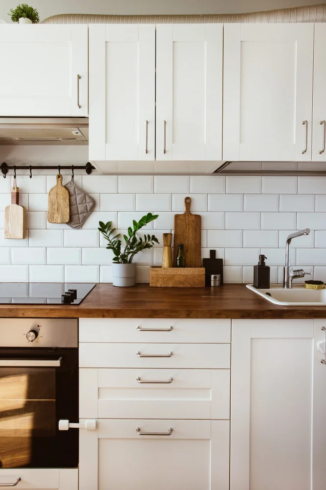 Bronze hardware on white cabinets