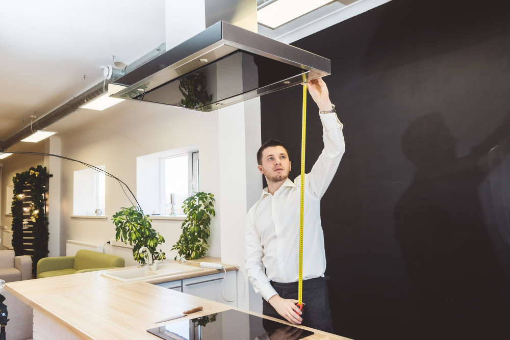 man measuring kitchen