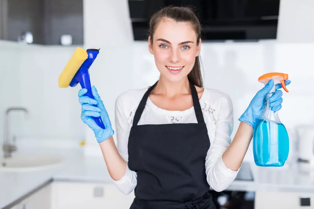 woman with kitchen cleaning tools