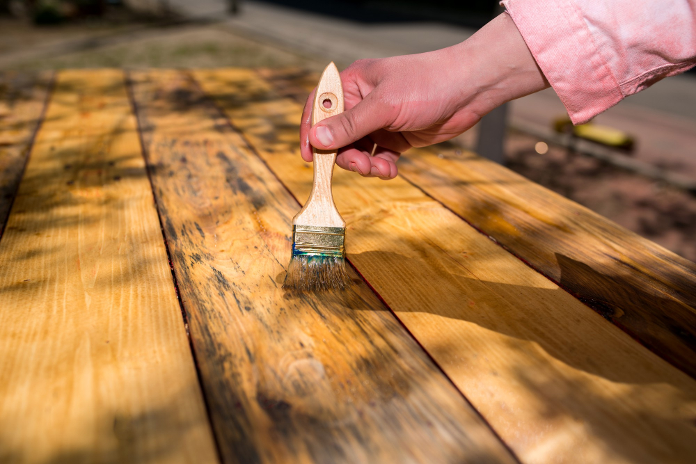 applying varnish to Kitchen Table