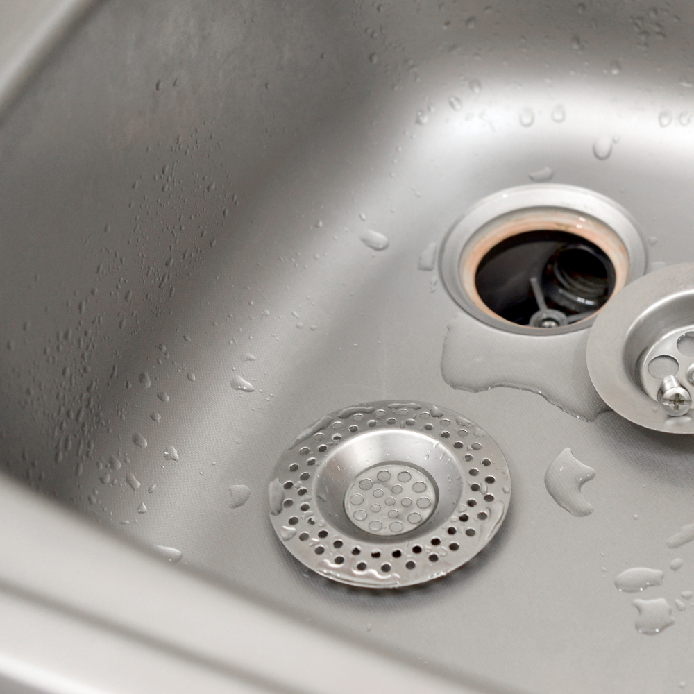 Rinsing the Kitchen Sink Strainer 