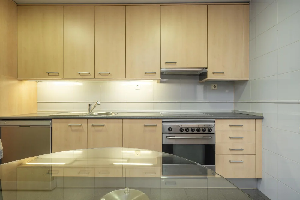 Beech Wood Kitchen Cabinets Stainless Steel Appliances Glass Table
