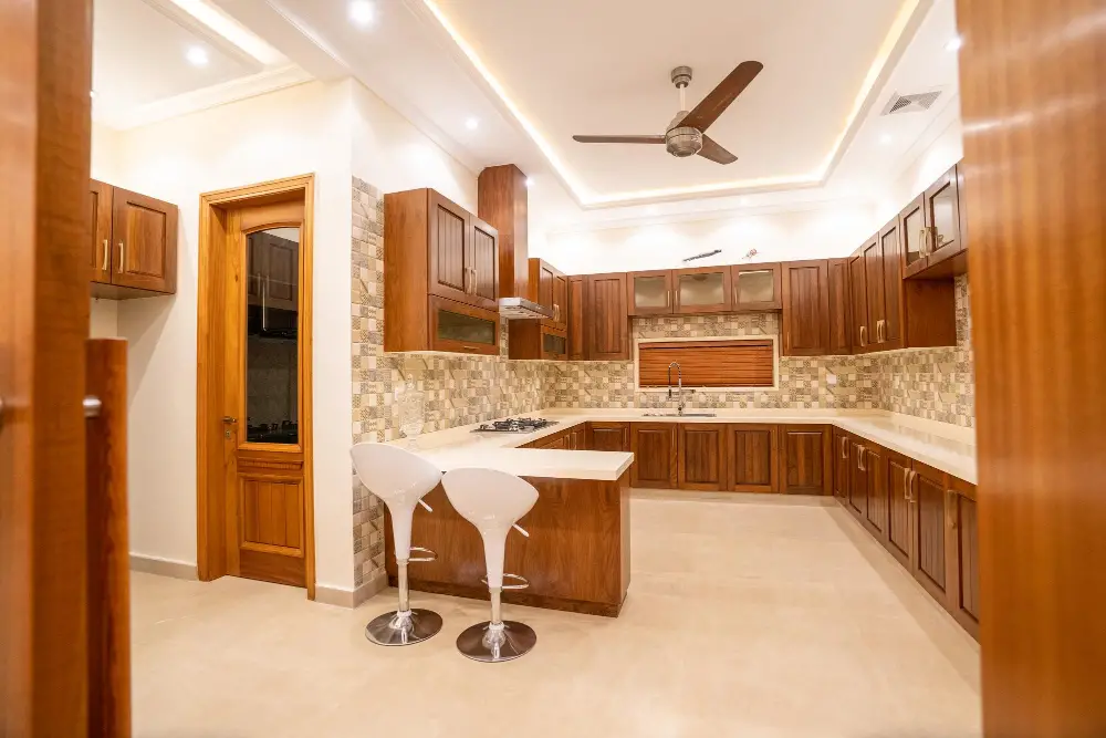 Benefits of a Kitchen Ceiling Standard Fan White Chairs Wooden Cabinets 