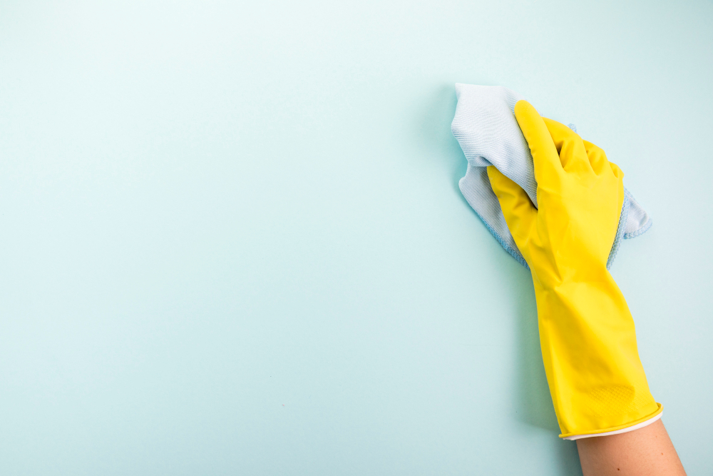 Cleaning Wall with Cloth for Kitchen Backsplash Installation 