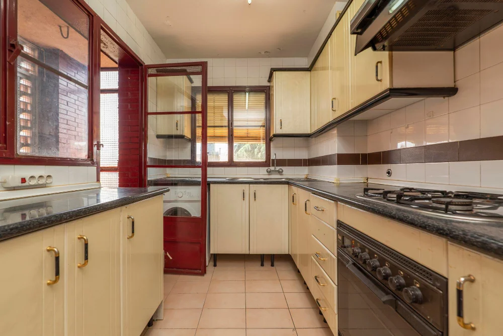 Cream Kitchen Cabinets with Black Accent