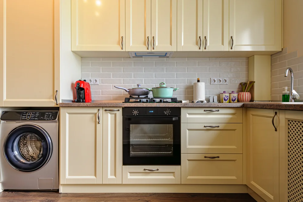 Cream Kitchen Cabinets with Brass Hardware