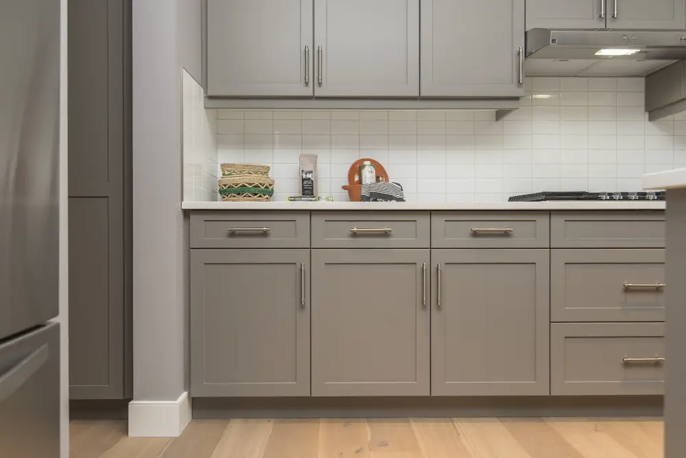 Gray Kitchen Cabinets White Backsplash Exhaust Hood