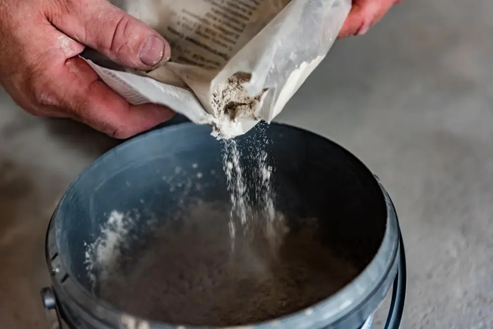 Mixing Grout Powder in a Bucket