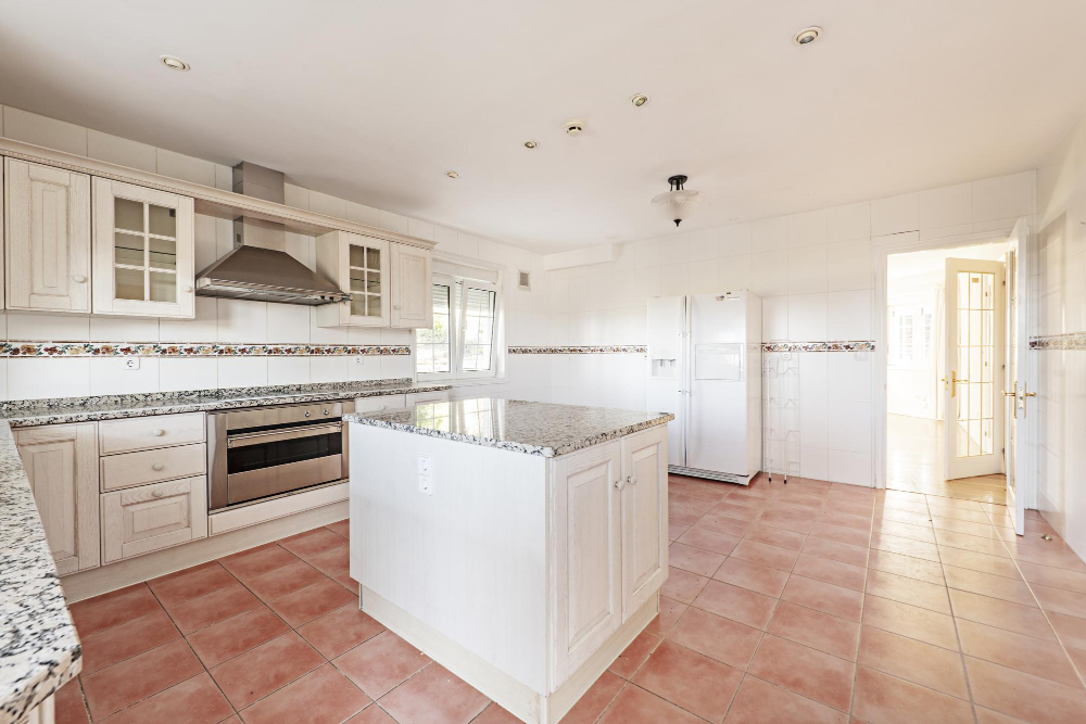 Old Vintage White Kitchen Cabinets with Polished Granite Countertops