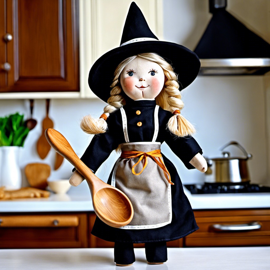 classic witch doll with apron and wooden spoon